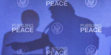 The shadows of U.S. President Donald Trump and Russian President Vladimir Putin are cast during a press conference following their meeting to negotiate an end to the war in Ukraine, at Joint Base Elmendorf-Richardson, in Anchorage, Alaska, U.S., August 15, 2025. REUTERS/Kevin Lamarque TPX IMAGES OF THE DAY